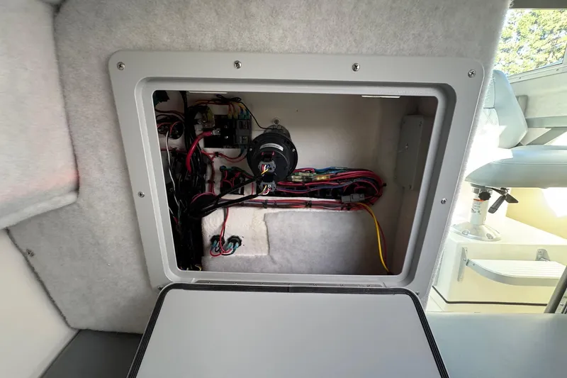 Slide: The Image of Electrical compartment of 2026 Defiance Admiral 250 EX boat, showcasing wiring and components. - 97