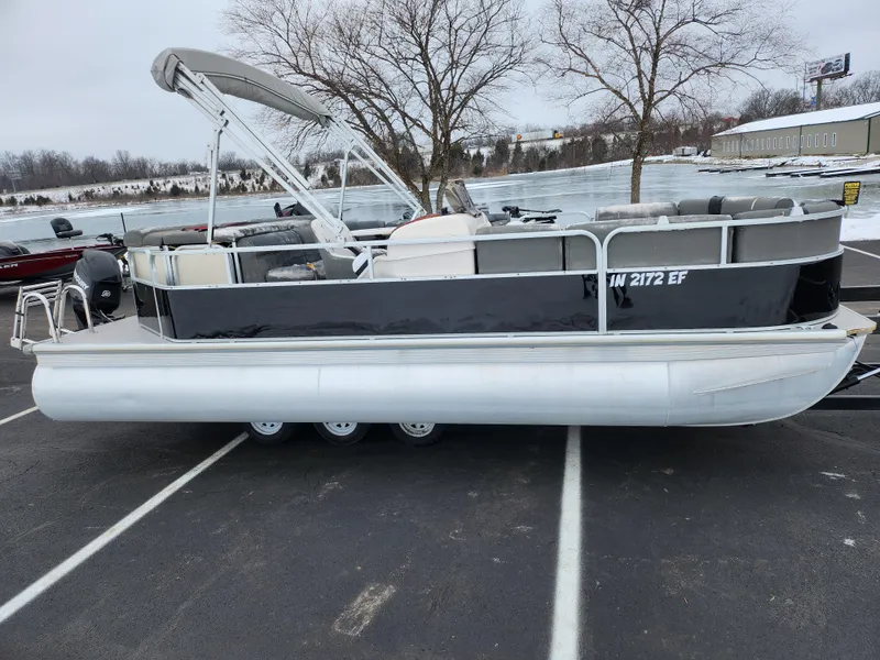 The Image of 2010 Misty Harbor 2085CR Adventure Cruiser pontoon boat in a parking lot. - 0