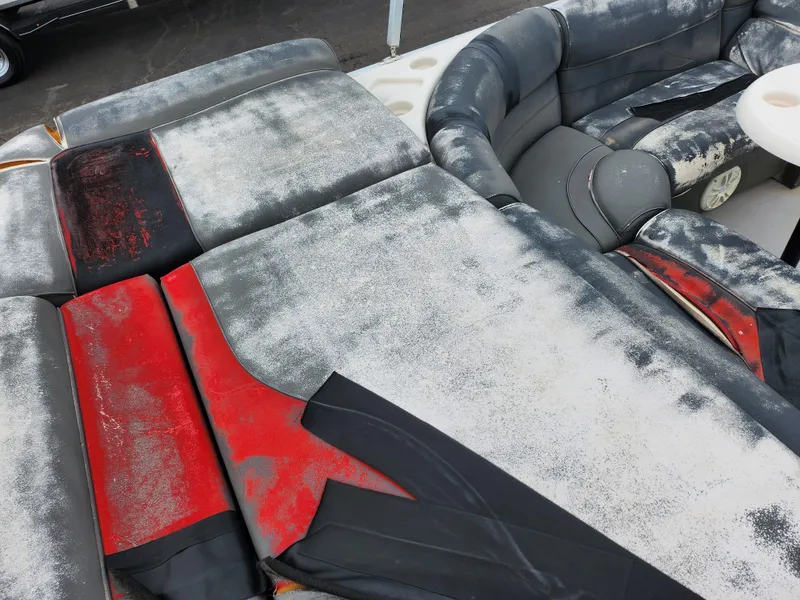 Slide: The Image of Worn seating on 2010 Misty Harbor 2085CR Adventure Cruiser boat, showing weathered upholstery. - 15