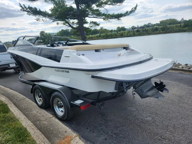Slide: The Image of 2016 Glastron GT 205 boat on trailer by a lake, ready for launch. - 1