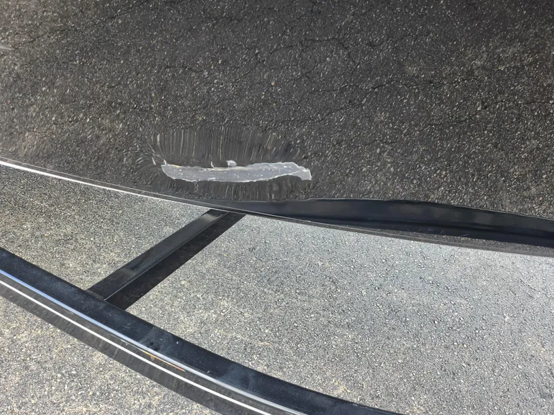 Slide: The Image of Scratch on 2016 Glastron GT 205 boat hull, close-up view. - 5