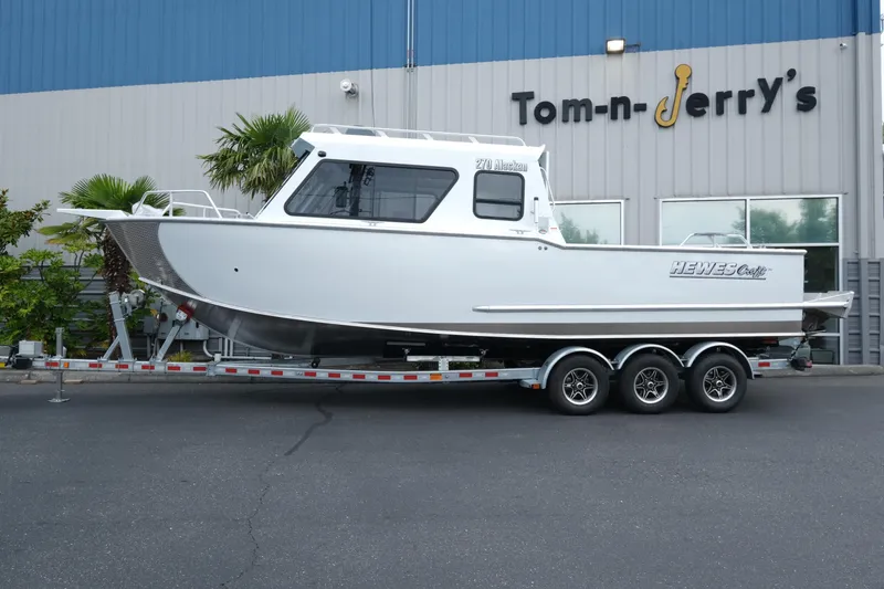 The Image of 2025 Hewescraft 270 Alaskan boat on trailer outside Tom-n-Jerry's store. - 1