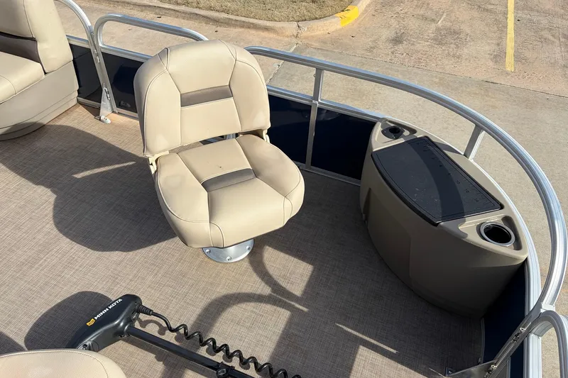 Slide: The Image of 2025 Sun Tracker Bass Buggy 18 DLX boat interior with seating and storage. - 14