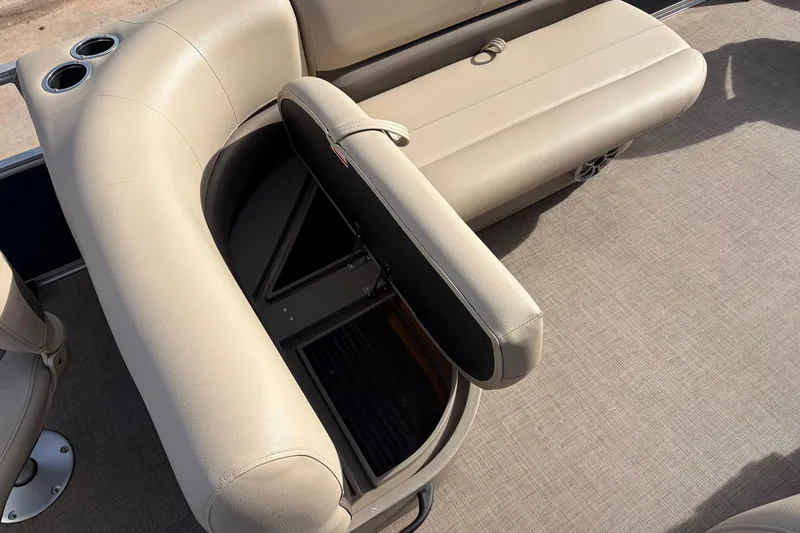 Slide: The Image of 2025 Sun Tracker Bass Buggy 18 DLX pontoon boat with open storage compartment. - 22