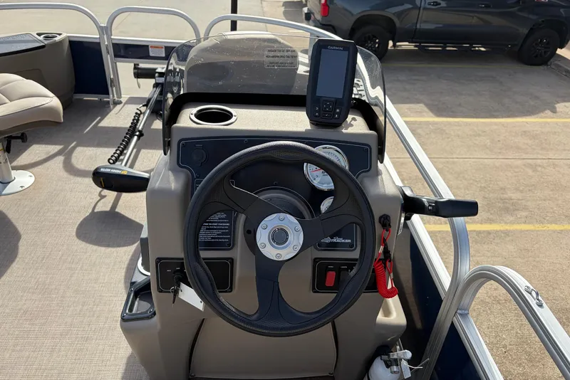 Slide: The Image of 2025 Sun Tracker Bass Buggy 18 DLX steering console with GPS and controls. - 26