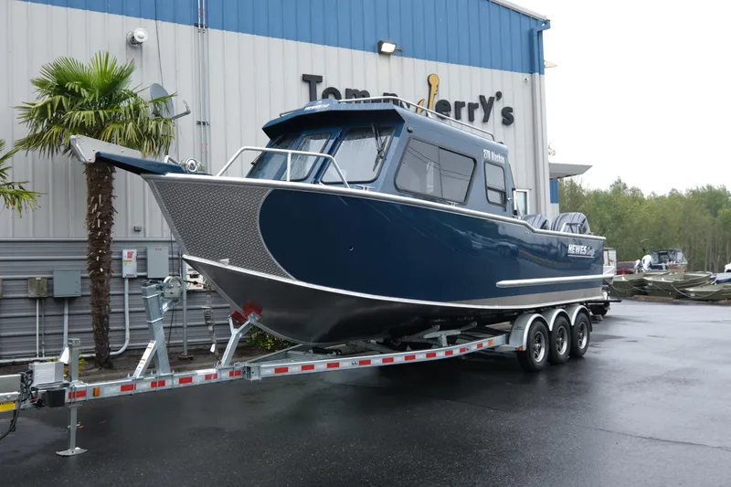 The Image of 2025 Hewescraft 270 Alaskan boat on trailer outside dealership. - 1