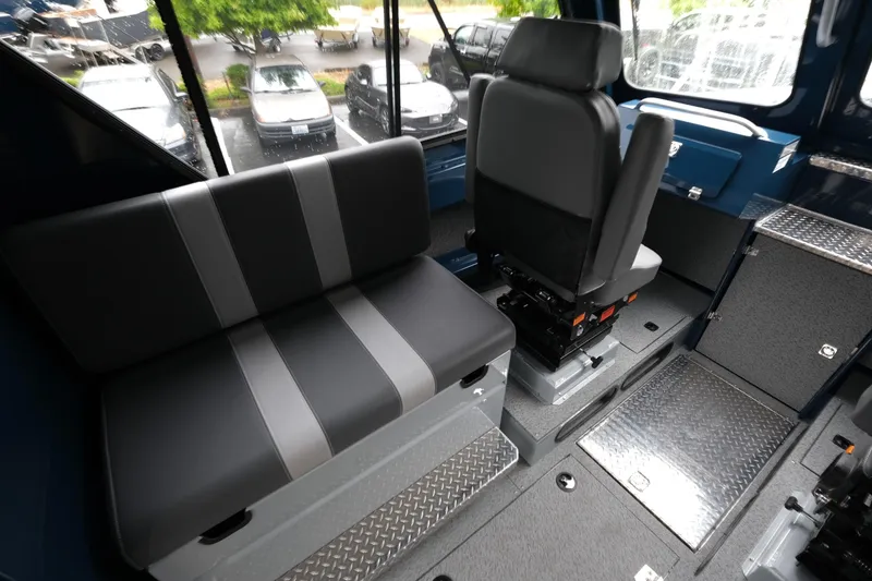 Slide: The Image of Interior of 2025 Hewescraft 270 Alaskan boat with seating and storage compartments. - 11