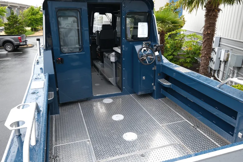 Slide: The Image of 2025 Hewescraft 270 Alaskan boat with open cabin and metal flooring. - 7