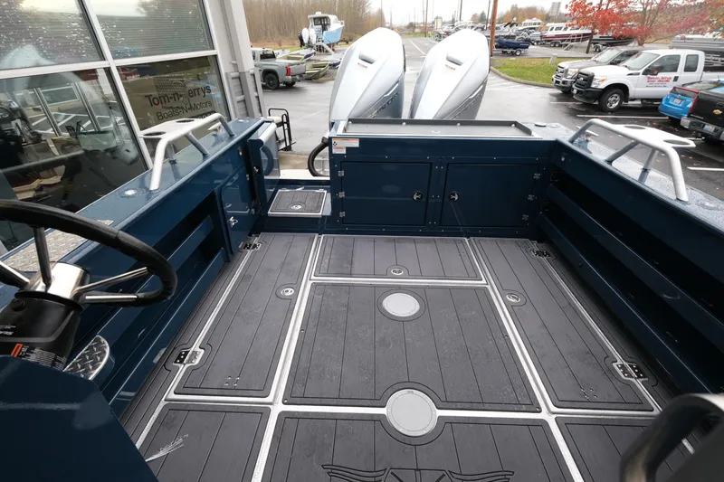 Slide: The Image of 2026 Hewescraft 250 Pacific Explorer boat interior with dual engines and spacious deck. - 8