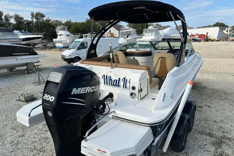 Slide: The Image of 2015 Sea Ray 220 Sundeck Outboard with Mercury engine in a boatyard. - 16