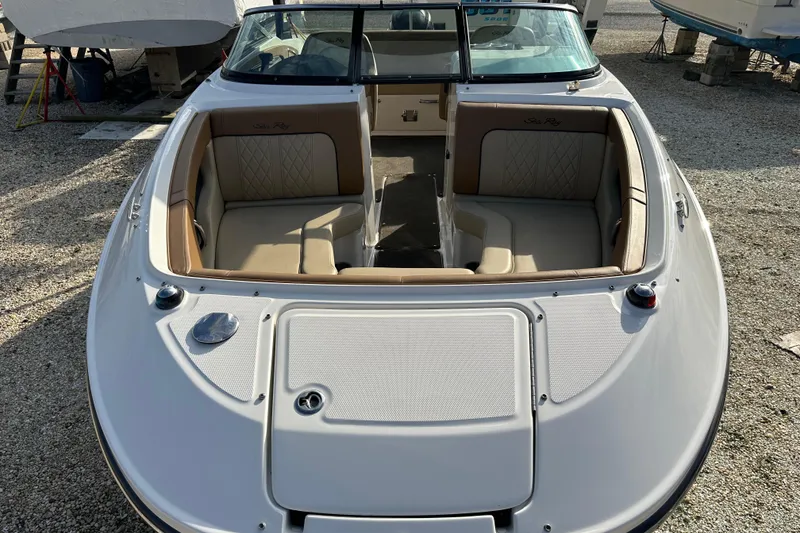 Slide: The Image of 2015 Sea Ray 220 Sundeck Outboard boat with spacious seating and sleek design. - 2