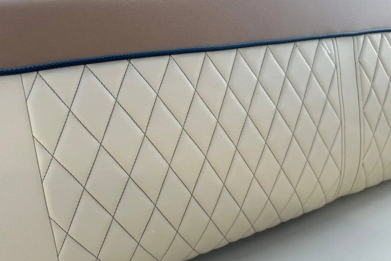Slide: The Image of Quilted leather upholstery detail on 2015 Sea Ray 220 Sundeck Outboard. - 25