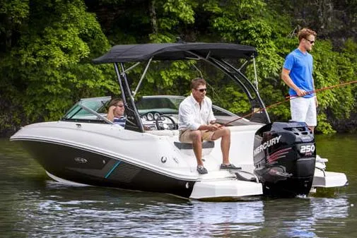 Slide: The Image of Manufacturer Provided Image: 2015 Sea Ray 220 Sundeck Outboard boat with people fishing on a lake. - 5