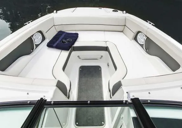 Slide: The Image of Manufacturer Provided Image: 2015 Sea Ray 220 Sundeck Outboard boat interior with spacious seating and storage. - 7