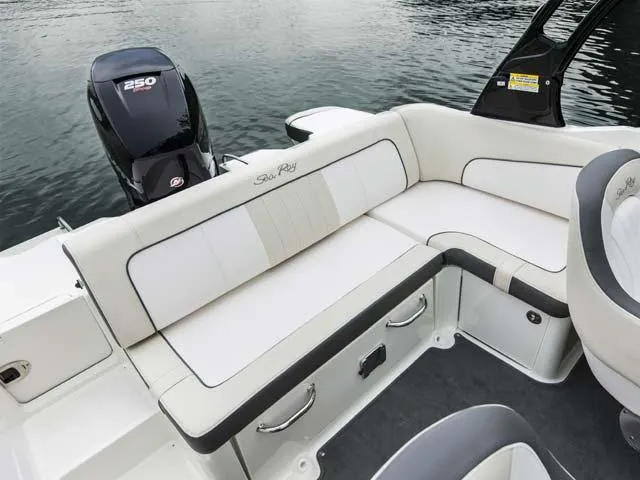 Slide: The Image of Manufacturer Provided Image: 2015 Sea Ray 220 Sundeck Outboard boat interior with seating and 250 HP engine. - 9