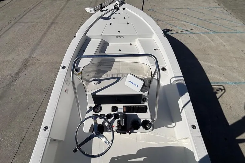 Slide: The Image of 2013 BlackJack 224 boat with steering console and navigation equipment on deck. - 11