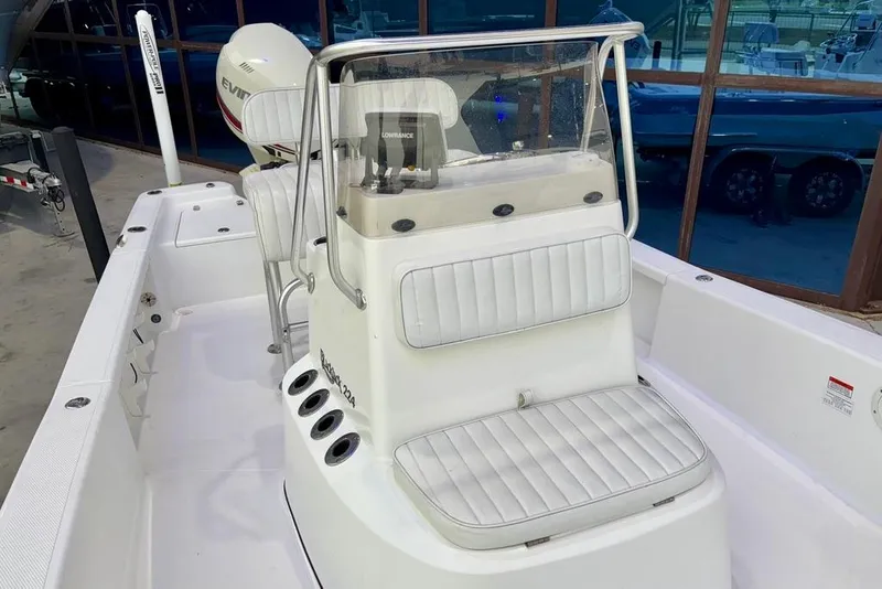 Slide: The Image of 2013 BlackJack 224 boat interior with white seating and console. - 19