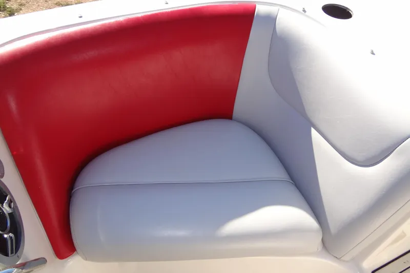 Slide: The Image of Red and gray seating in 2003 Ski Centurion Tsunami boat interior. - 13