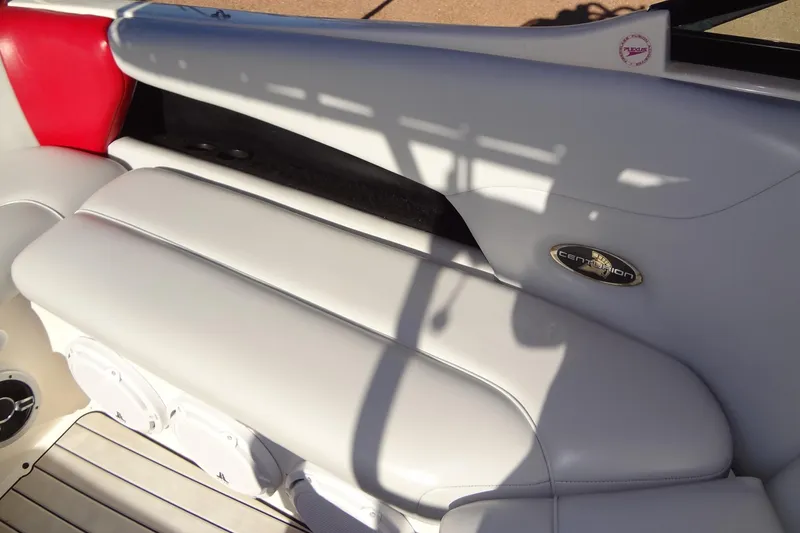 Slide: The Image of 2003 Ski Centurion Tsunami boat interior with white and red seating. - 23