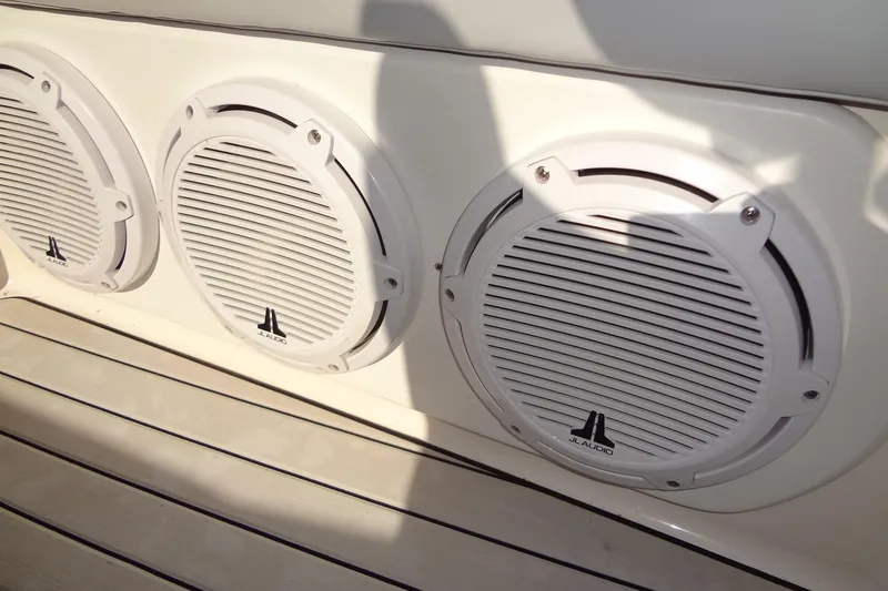 Slide: The Image of White JL Audio speakers on a 2003 Ski Centurion Tsunami boat. - 30