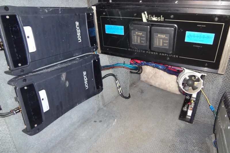 Slide: The Image of Audio system setup in a 2003 Ski Centurion Tsunami with amplifiers and wiring. - 32