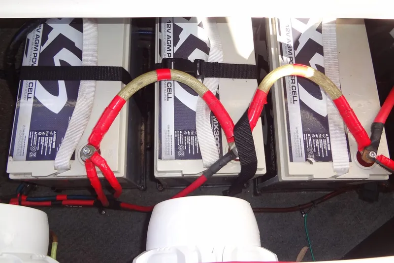 Slide: The Image of Three 12V AGM batteries connected in a 2003 Ski Centurion Tsunami boat. - 34