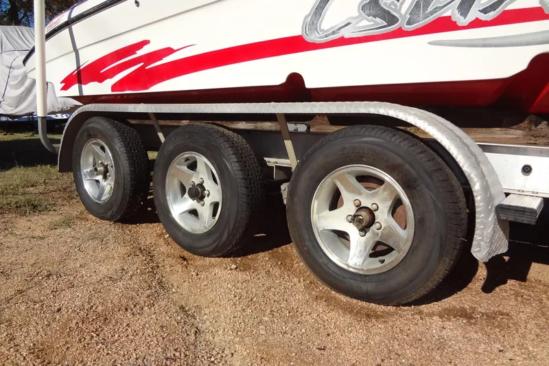 Slide: The Image of Trailer with triple axle wheels for 2003 Ski Centurion Tsunami boat. - 39