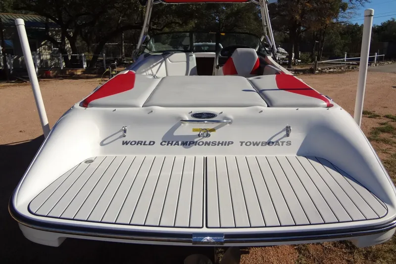 Slide: The Image of 2003 Ski Centurion Tsunami boat with red accents, labeled "World Championship Towboats." - 4