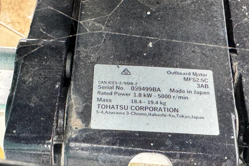 Slide: The Image of Label on Tohatsu outboard motor, model MFS2.5C, showing specifications and serial number. - 22