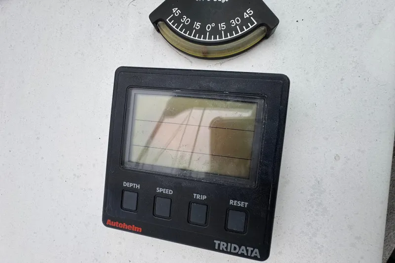 Slide: The Image of Autohelm Tridata display on 1992 Hunter 33.5 sailboat, showing depth, speed, and trip functions. - 25