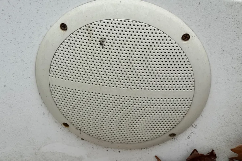 Slide: The Image of Round speaker grille on a 1992 Hunter 33.5 boat, mounted on a white surface. - 31