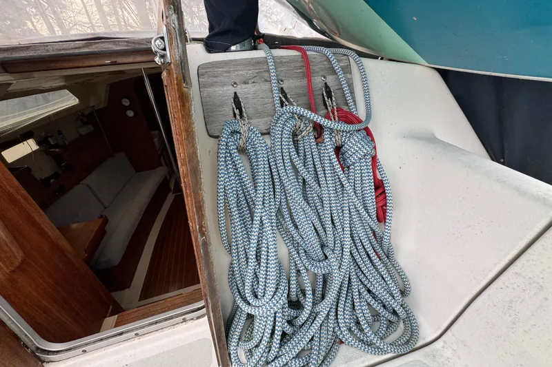 Slide: The Image of Ropes on a 1992 Hunter 33.5 sailboat, near cabin entrance. - 32
