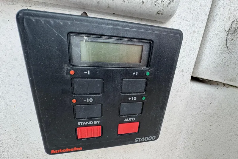 Slide: The Image of Autopilot control panel on 1992 Hunter 33.5 sailboat, featuring Autohelm ST4000. - 33