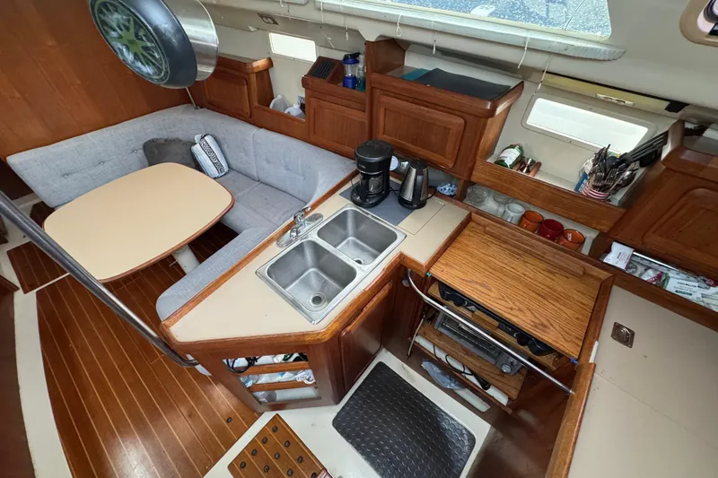 Slide: The Image of Interior of a 1992 Hunter 33.5 sailboat with kitchen and dining area. - 42