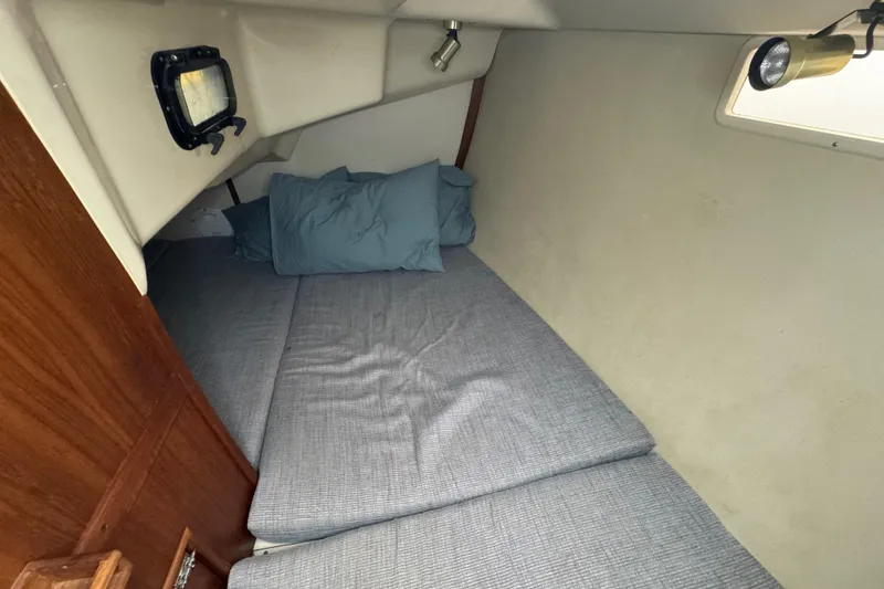 Slide: The Image of Cozy cabin interior of 1992 Hunter 33.5 sailboat with cushions and pillows. - 64