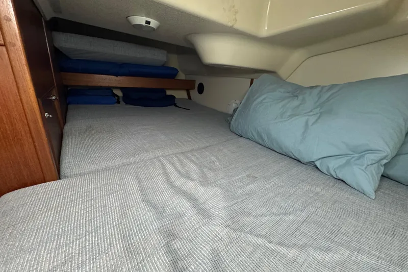 Slide: The Image of Cozy cabin interior of 1992 Hunter 33.5 sailboat with comfortable bedding. - 67