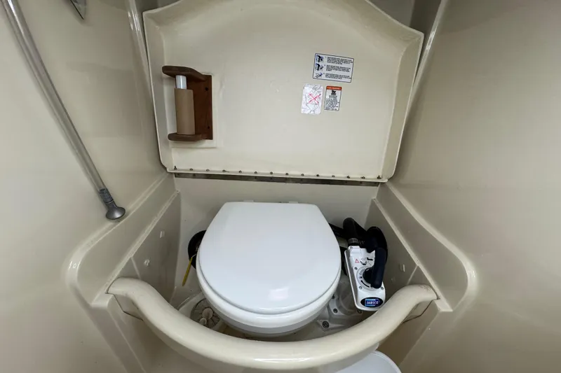 Slide: The Image of Compact marine toilet in a 1992 Hunter 33.5 sailboat bathroom. - 78