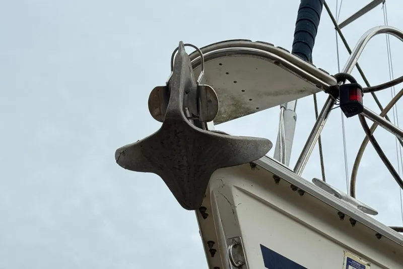 Slide: The Image of Close-up of a 1992 Hunter 33.5 sailboat anchor and bow details. - 9