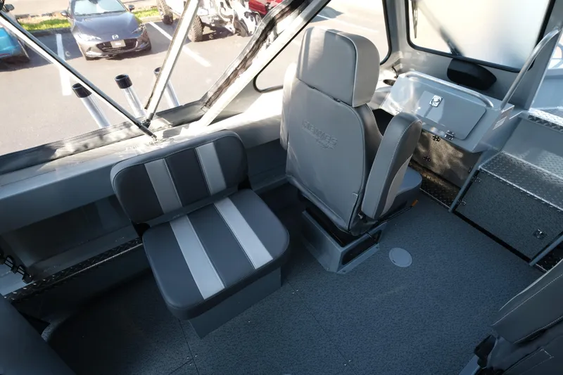Slide: The Image of Interior of 2025 Hewescraft 190 SeaRunner ET boat with gray seating and dashboard. - 8