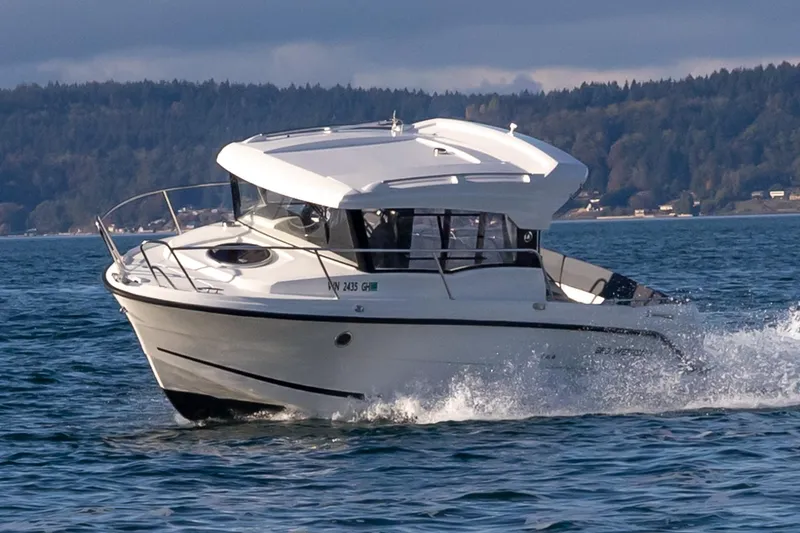 The Image of 2023 Parker Poland Skamander boat cruising on a scenic lake. - 0