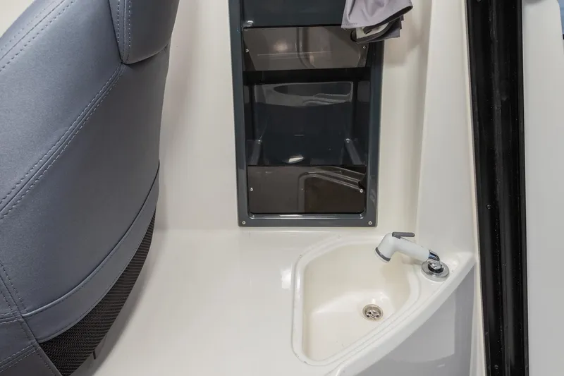 Slide: The Image of 2023 Parker Poland Skamander boat interior with sink and storage compartments. - 10
