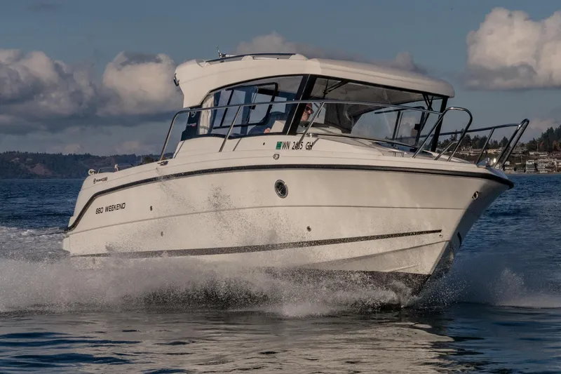 Slide: The Image of 2023 Parker Poland Skamander boat cruising on a sunny day. - 11