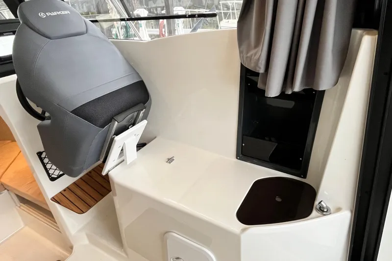 Slide: The Image of 2023 Parker Poland Skamander boat interior with gray seat and modern design elements. - 14