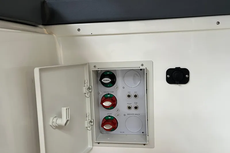 Slide: The Image of Control panel inside 2023 Parker Poland Skamander boat, featuring switches and connectors. - 15