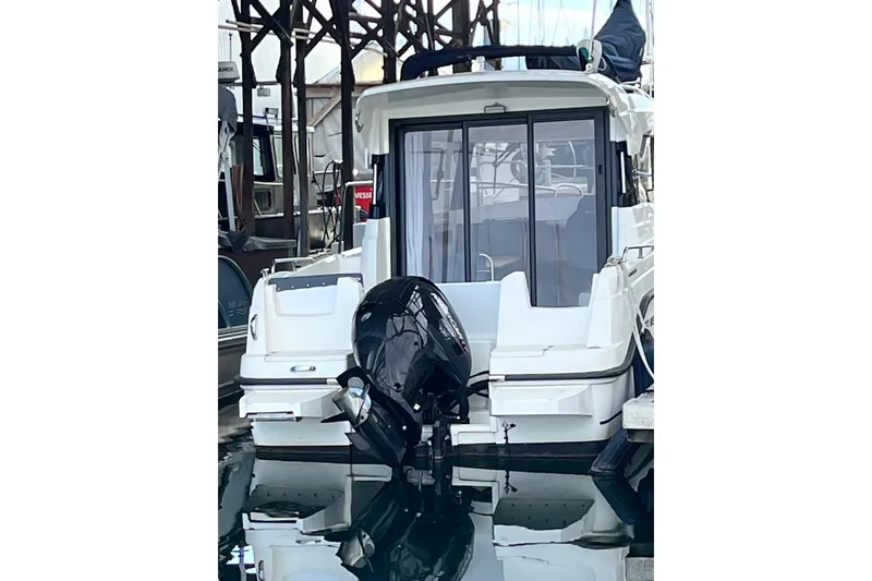 Slide: The Image of 2023 Parker Poland Skamander boat docked with outboard motor, rear view. - 23