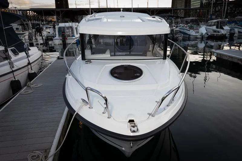 Slide: The Image of 2023 Parker Poland Skamander boat docked in marina, front view. - 6