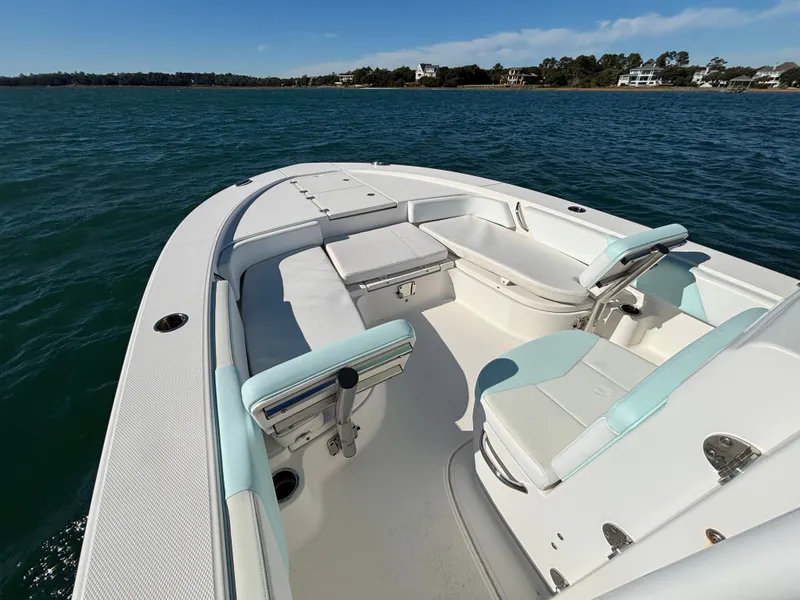 Slide: The Image of 2018 Robalo 246 Cayman boat on calm water. - 10
