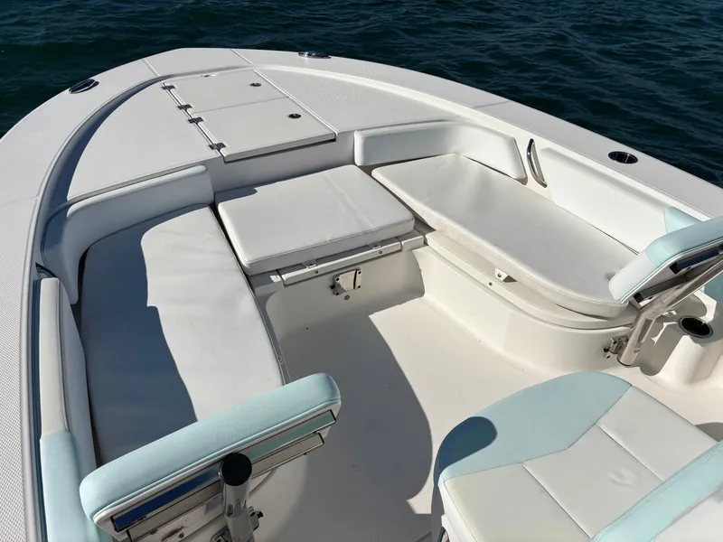 Slide: The Image of Interior of a 2018 Robalo 246 Cayman boat on the water. - 11