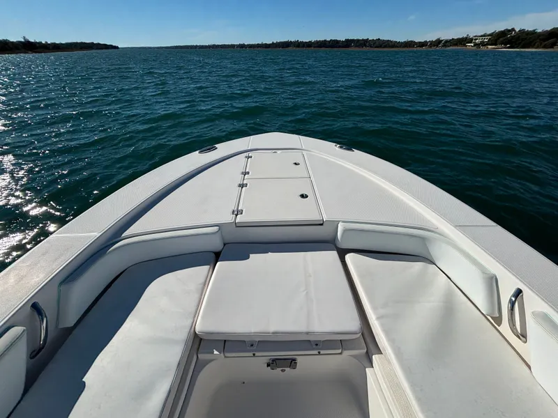 Slide: The Image of 2018 Robalo 246 Cayman on open water, bow deck view. - 13