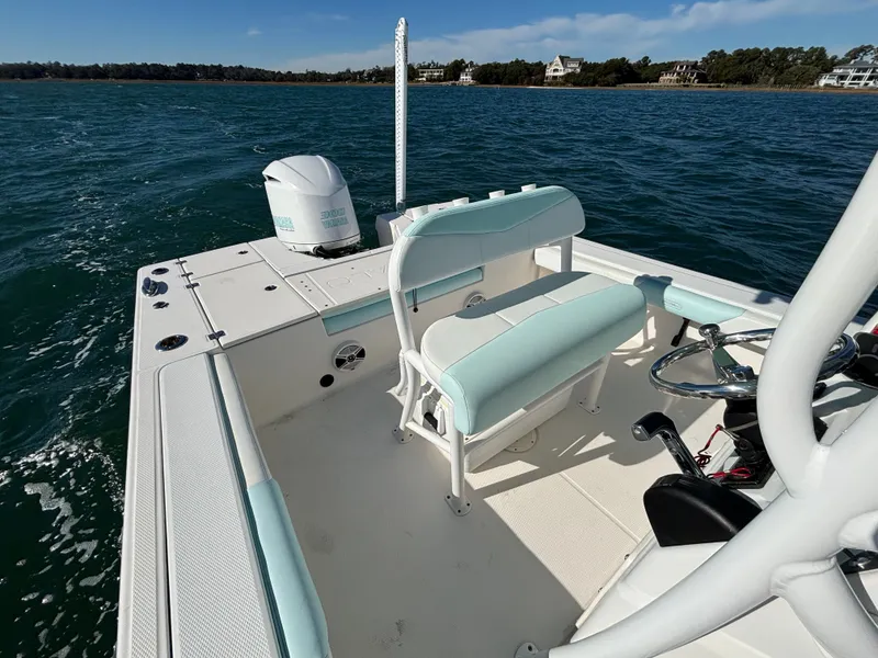 Slide: The Image of 2018 Robalo 246 Cayman boat on open water. - 15